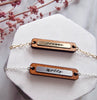 two personalised necklaces in silver and gold, personalised with names