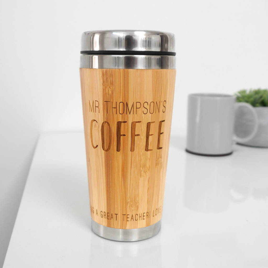 Personalised bamboo coffee mug on a white table